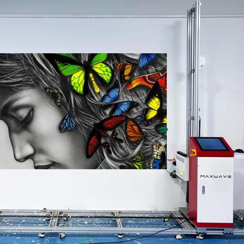 Track-rail wall printer printing a large butterfly portrait on an interior wall