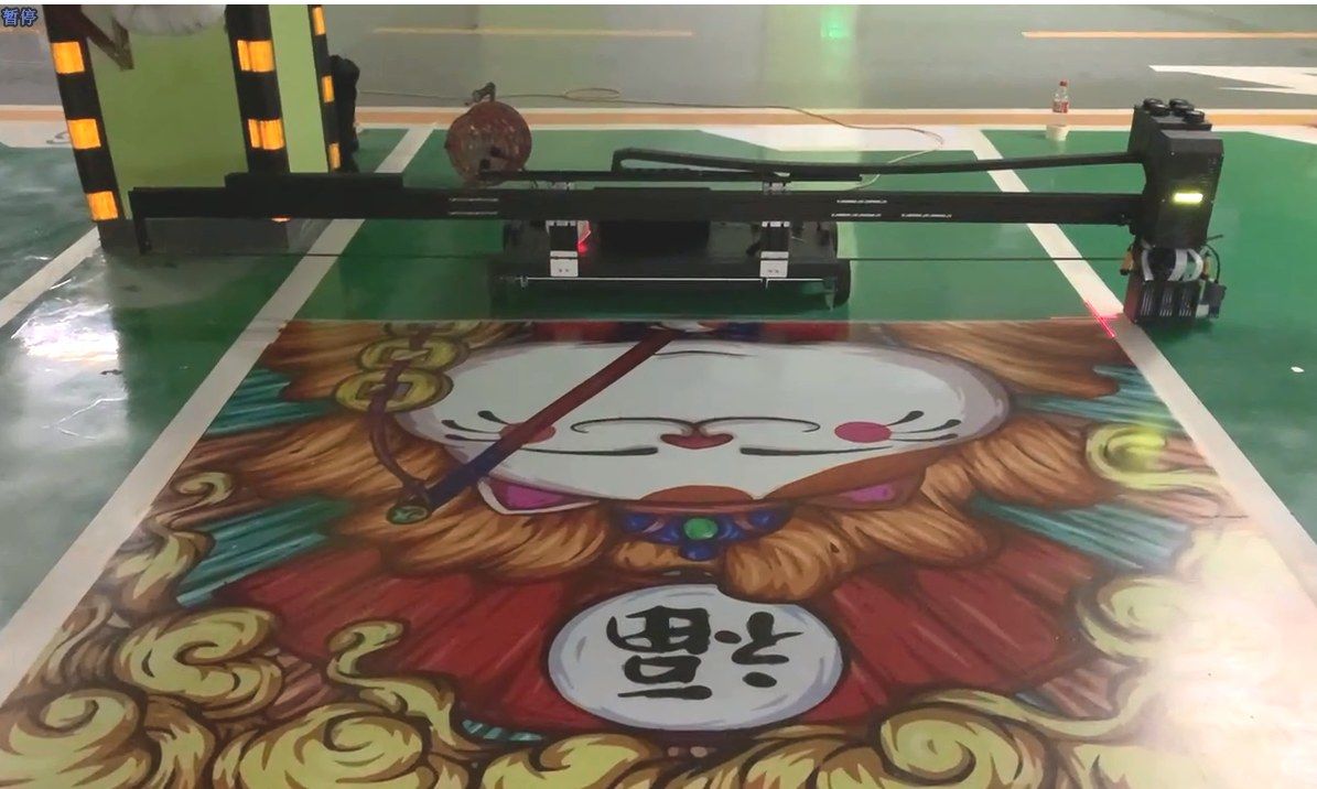 Floor printer printing a large decorative design on a car-park floor