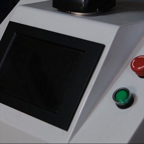 Close-up of the touch control panel with the power and emergency-stop buttons