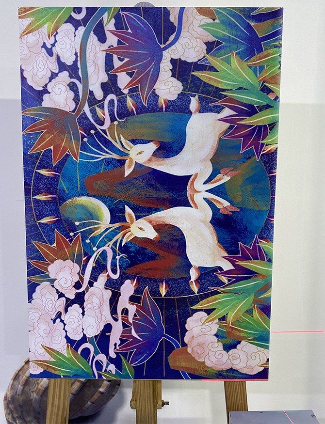 Mural design printed on a wooden board, shown on an easel
