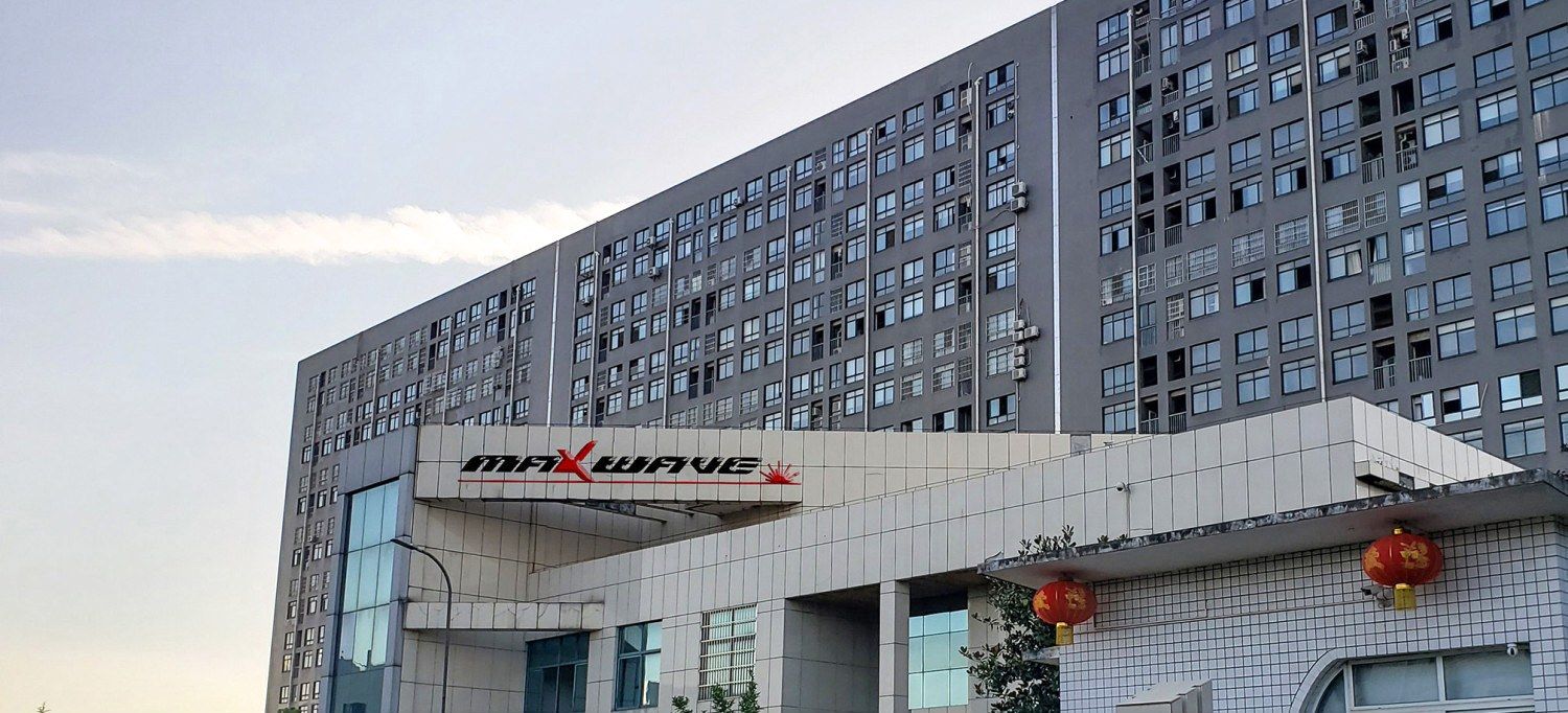 The Maxwave Laser building in Panlongcheng, Huangpi District, Wuhan, with the MAXWAVE sign over the entrance